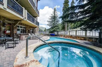 a swimming pool in the middle of a house at Lone Eagle 2 Bedroom Condo in Dillon