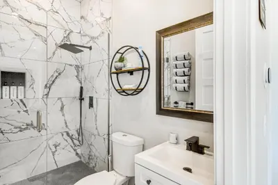 a bathroom with a shower and a toilet and a sink at Romantic Mountain Retreat with Scenic Views! in Idaho Springs