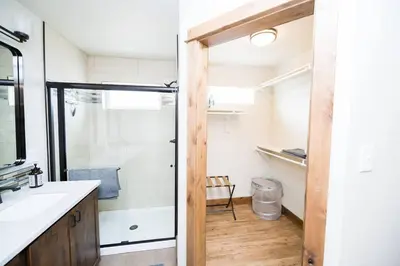 a bathroom with a shower and a sink at Sundance-2 miles to Rocky Mountain National Park in Estes Park