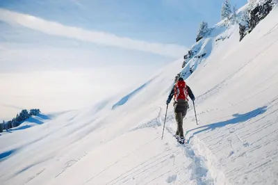 a person is skiing down a snow covered slope at Crossroads Nordic Townhome: Spacious, On Bike Path in Frisco