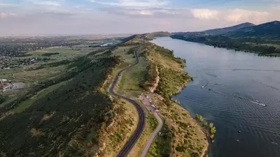 an aerial view of a road on an island in the water at Hidden Gem - Brand New Curated Home with Pool Access in Fort Collins