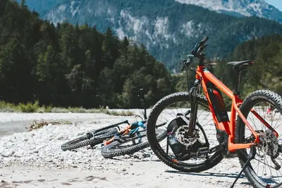two bikes parked on a beach with mountains in the background at Mountainside Pineview Condo: Cozy Frisco Retreat in Frisco