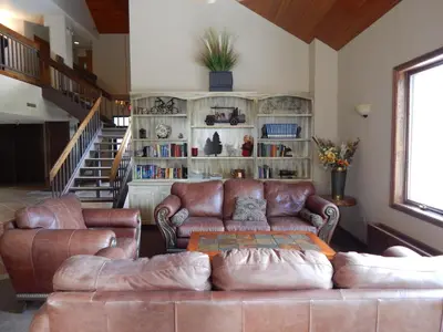 a living room with a couch and a book shelf at Iron Horse Building J Unit 1309 in Winter Park