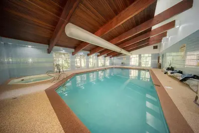 a large indoor swimming pool in a house at Beaver Village Unit #0521 in Winter Park
