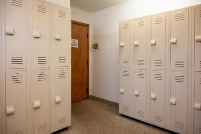 a row of white lockers in a locker room at Beaver Village Unit #0412 in Winter Park