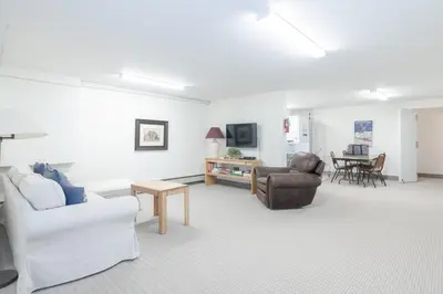 a living room with a couch and chairs and a table at Beaver Village Unit #0612 in Winter Park