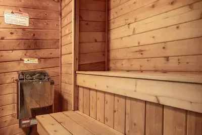 a sauna with a bench in a wooden cabin at Beaver Village Unit #0514 in Winter Park
