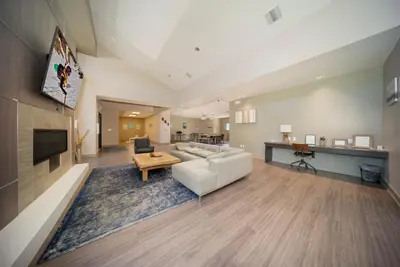 a living room with a white couch and a table at Hi Country Haus Unit 0406 in Winter Park