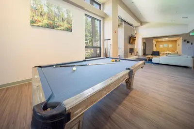 a pool table in a living room with at Hi Country Haus Unit 0309 in Winter Park