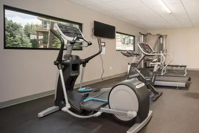a gym with two exercise bikes in a room at Hi Country Haus Unit 0309 in Winter Park