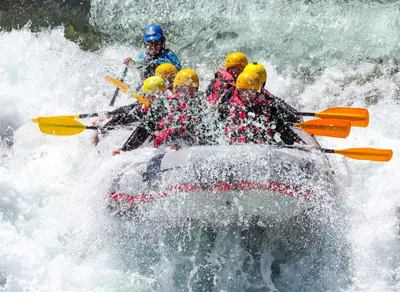 a group of people in a raft in a river at Lake View Condo: Walk To Downtown/Lake Dillon in Dillon