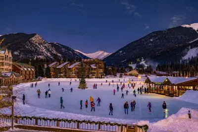 a group of people skating on a rink in the snow at Silver Mill 8167 - 1Br-Walk to Slopes! Kids Ski Free! condo in Keystone