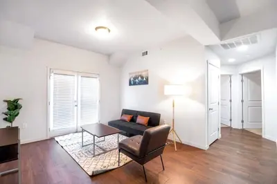 a living room with a couch and a table at Fully Furnished 2BR Centrally Located with Pool in Greeley