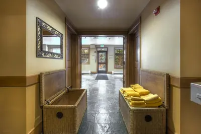 a hallway with a pile of yellow folded towels at Lone Eagle 3017 in Keystone