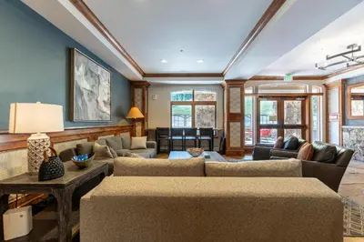 a living room with a couch and a table at Lone Eagle 3017 in Keystone